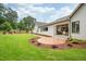 Spacious backyard with a patio and manicured lawn, perfect for outdoor activities at 4412 Pamlico Dr, Raleigh, NC 27609