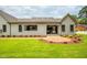 Expansive backyard featuring a patio, lush lawn, and beautifully landscaped surroundings at 4412 Pamlico Dr, Raleigh, NC 27609