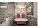 Bathroom featuring a clawfoot bathtub and glass-enclosed walk-in shower at 4412 Pamlico Dr, Raleigh, NC 27609