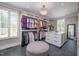 Spacious walk-in closet with custom shelves, drawers, and a central ottoman at 4412 Pamlico Dr, Raleigh, NC 27609