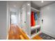 Stylish entryway featuring a coat rack with bench seating and shoe storage, plus hardwood flooring at 4412 Pamlico Dr, Raleigh, NC 27609