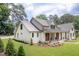 Charming home with a lush green lawn and lovely landscaping, showcasing its inviting curb appeal at 4412 Pamlico Dr, Raleigh, NC 27609