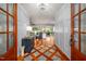 Welcoming foyer with hardwood floors, wainscoting, and views into the spacious living area beyond at 4412 Pamlico Dr, Raleigh, NC 27609