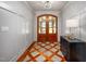 Inviting foyer with decorative tile, stylish furnishings, and a glimpse of the home's elegant entrance at 4412 Pamlico Dr, Raleigh, NC 27609