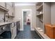 Well-equipped laundry room featuring modern washer and dryer, with dog wash station and a soaking tub visible at 4412 Pamlico Dr, Raleigh, NC 27609