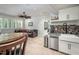 The lower level features a cozy living area with a kitchenette, a leather couch, and large windows at 4412 Pamlico Dr, Raleigh, NC 27609
