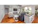 Bright living room features a stone fireplace, built-in shelving, and hardwood floors at 4412 Pamlico Dr, Raleigh, NC 27609