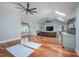 Spacious living room with vaulted ceilings, hardwood floors, and built in bar with seating at 4412 Pamlico Dr, Raleigh, NC 27609