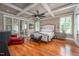 Elegant main bedroom with coffered ceiling, hardwood floors, and natural light from the windows at 4412 Pamlico Dr, Raleigh, NC 27609