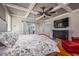Spacious main bedroom featuring hardwood floors and a view of the bathroom through sliding glass doors at 4412 Pamlico Dr, Raleigh, NC 27609
