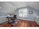 Bright office space with built-in cabinets, hardwood flooring, and natural light at 4412 Pamlico Dr, Raleigh, NC 27609