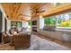 Covered outdoor space featuring a fireplace, ceiling fans, television, and built in barbeque at 4412 Pamlico Dr, Raleigh, NC 27609