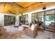 Inviting outdoor living area with comfortable seating, ceiling fans, and stone flooring at 4412 Pamlico Dr, Raleigh, NC 27609