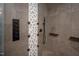 Close-up of custom walk-in shower with wall jets and hexagonal tiling at 4412 Pamlico Dr, Raleigh, NC 27609