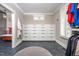 Spacious walk-in closet with custom built-ins, including drawers and hanging space, plus access to the bathroom at 4412 Pamlico Dr, Raleigh, NC 27609