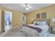 Comfortable bedroom with a queen bed, ceiling fan, and an en-suite bathroom at 4600 Townesbury Ln, Raleigh, NC 27612