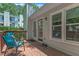 Outdoor deck featuring wood flooring, a blue chair, and an access door to the house at 4600 Townesbury Ln, Raleigh, NC 27612