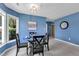 Chic dining room with a glass-top table, four chairs, and ample natural light at 4600 Townesbury Ln, Raleigh, NC 27612