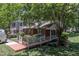 Charming brick townhouse with a unique red bridge and well-maintained landscaping enhancing curb appeal at 4600 Townesbury Ln, Raleigh, NC 27612