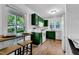 Stylish kitchen with a breakfast bar, modern appliances, and bright, natural lighting at 4600 Townesbury Ln, Raleigh, NC 27612