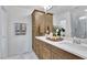 Elegant bathroom with double sinks, sleek white countertop, and stylish cabinets at 5032 Jowetts Walk Dr # 26, Cary, NC 27519