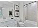 Modern bathroom features shower-over-tub combination and white vanity with drawers for ample storage at 5032 Jowetts Walk Dr # 26, Cary, NC 27519