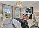Bright bedroom features two large windows with natural light and modern décor including striped walls at 5032 Jowetts Walk Dr # 26, Cary, NC 27519