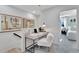 Cozy office nook showcasing white walls, modern desk, and seamless integration of work and relaxation at 5032 Jowetts Walk Dr # 26, Cary, NC 27519
