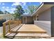 Wooden back deck with railing offering great space for outdoor seating and relaxation at 506 W Walnut St, Selma, NC 27576