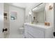 Renovated bathroom featuring modern vanity, tiled floors, and new fixtures at 506 W Walnut St, Selma, NC 27576