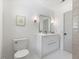 Bright bathroom with a modern vanity, fresh paint, and tiled floors at 506 W Walnut St, Selma, NC 27576