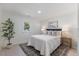 Cozy bedroom with a large window, fresh paint, and new floors at 506 W Walnut St, Selma, NC 27576
