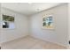 Bright bedroom features wood-look floors and natural light from the two windows at 506 W Walnut St, Selma, NC 27576