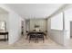 Dining room with hardwood floors, decorative accent wall, and open doorway to living spaces at 506 W Walnut St, Selma, NC 27576