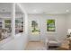 Bright entryway featuring light hardwood floors, natural light, and neutral decor at 506 W Walnut St, Selma, NC 27576