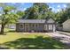 Charming single-story home featuring a freshly painted exterior and a well-manicured front lawn at 506 W Walnut St, Selma, NC 27576