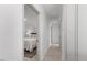 Hallway leading to bedroom, showcasing freshly painted walls and new flooring at 506 W Walnut St, Selma, NC 27576