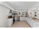 Bright kitchen features stainless steel appliances, granite countertops, and white cabinetry at 506 W Walnut St, Selma, NC 27576