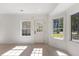 Sun-filled living room with two windows, offering plenty of natural light at 506 W Walnut St, Selma, NC 27576