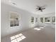 Bright and spacious living room featuring large windows and light hardwood floors at 506 W Walnut St, Selma, NC 27576