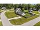Aerial view of the property with a fenced backyard and plenty of grassy area for activities at 509 Par Dr, Nashville, NC 27856