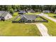 Aerial view of the property featuring a fenced backyard and front lawn at 509 Par Dr, Nashville, NC 27856