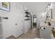 Well-lit bathroom with a single vanity, industrial shelving, and access to the bedroom at 509 Par Dr, Nashville, NC 27856