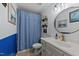 Coastal bathroom with blue wainscoting, a vanity, and a charming nautical theme at 509 Par Dr, Nashville, NC 27856