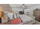 Spacious bedroom featuring a cozy bed, ceiling fan, and access to an office area at 509 Par Dr, Nashville, NC 27856