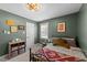 Bedroom featuring olive green walls, a comfortable bed, and stylish decor at 509 Par Dr, Nashville, NC 27856