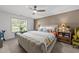 Comfortable bedroom features a neutral color palette, a ceiling fan, and natural light from a window at 509 Par Dr, Nashville, NC 27856