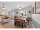 Charming dining area featuring a wood table, bench seating, and ample natural light at 509 Par Dr, Nashville, NC 27856