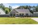 Charming single-story home featuring stone accents, a cozy front porch, and a well-maintained lawn at 509 Par Dr, Nashville, NC 27856