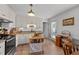 Well-equipped kitchen with granite countertops, white cabinets, stainless steel appliances, and a movable island at 509 Par Dr, Nashville, NC 27856